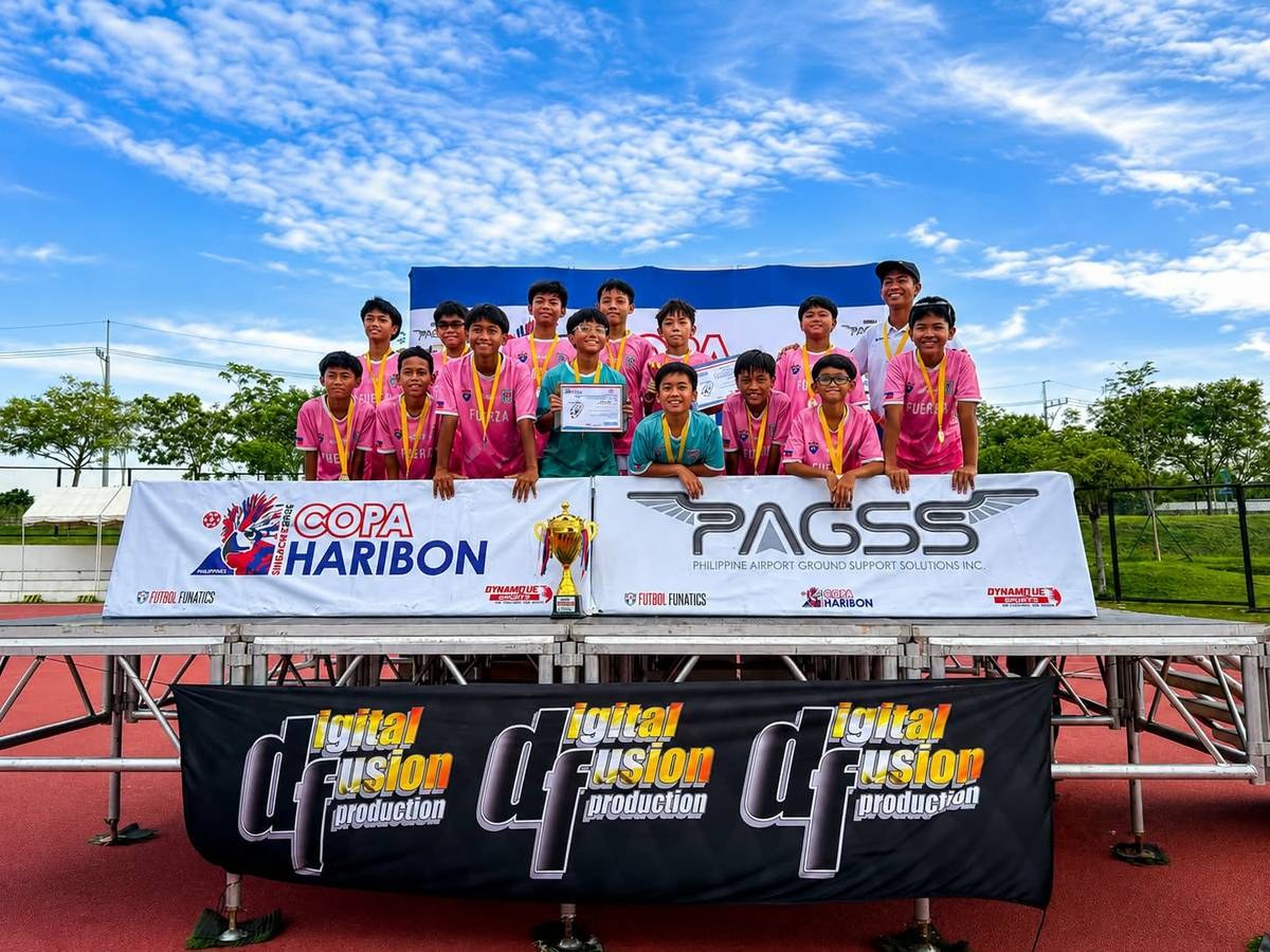 Fuerza FC players celebrating their Copa Haribon Championship U12 title